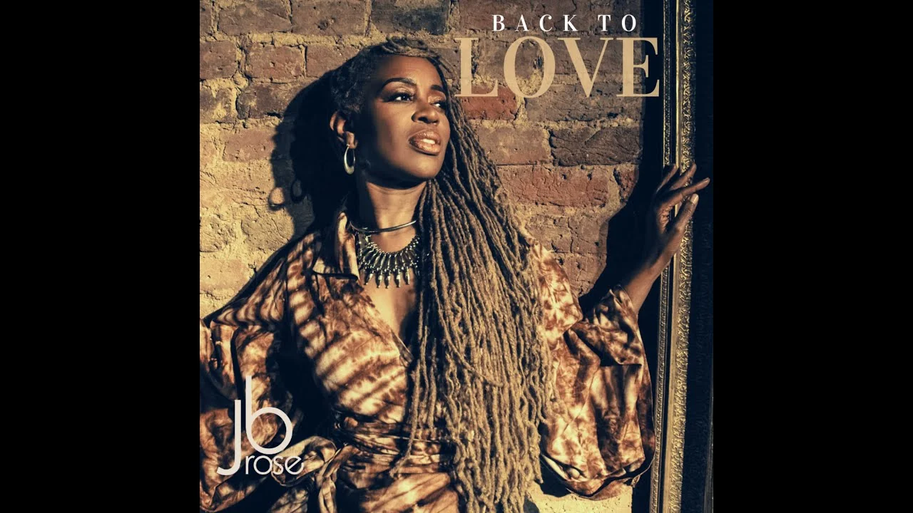 Cover artwork for Back to Love by JB Rose, showing her against a brick wall beside a gilt picture frame